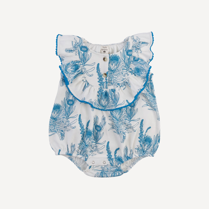 sleeveless ruffle button pom pom bubble | blue proteas | organic cotton interlock