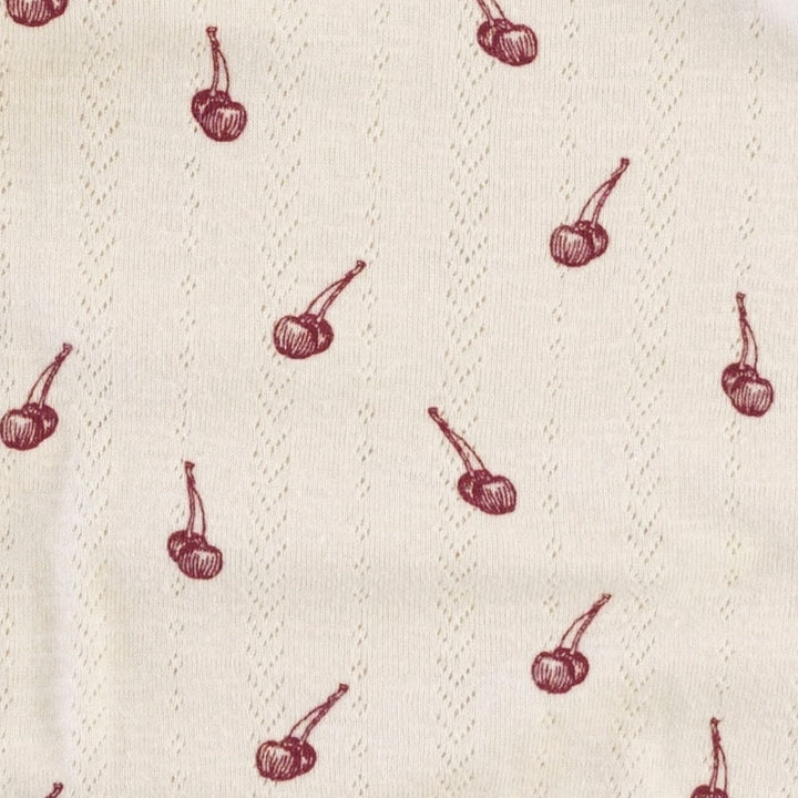 spaghetti tie ruffle button top | cherries | organic cotton pointelle