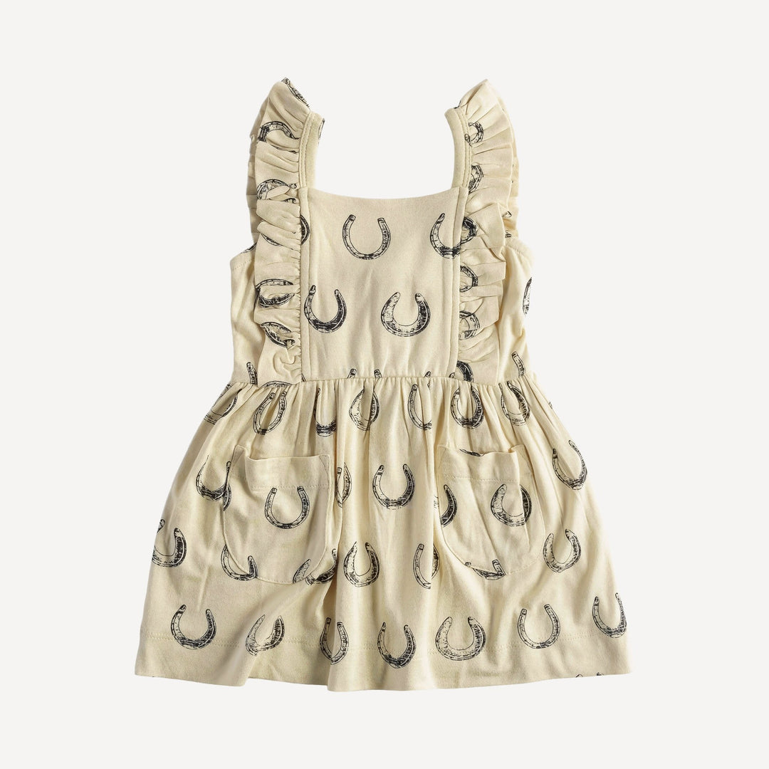 sleeveless pinafore ruffle dress | horse shoes | organic cotton jersey