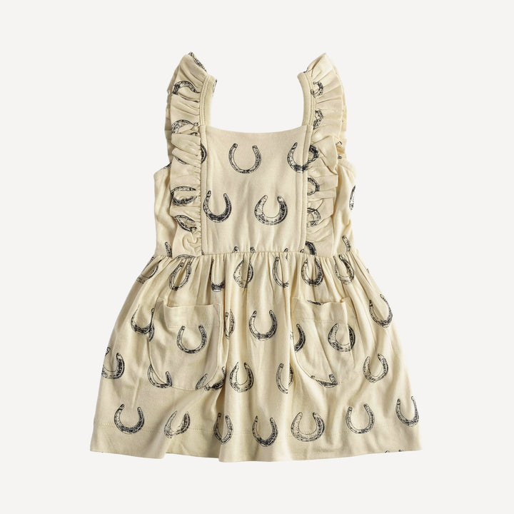 sleeveless pinafore ruffle dress | horse shoes | organic cotton jersey
