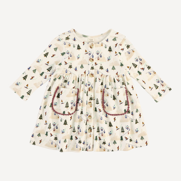 long sleeve pinafore apron pom pom pocket dress | ski village | bamboo