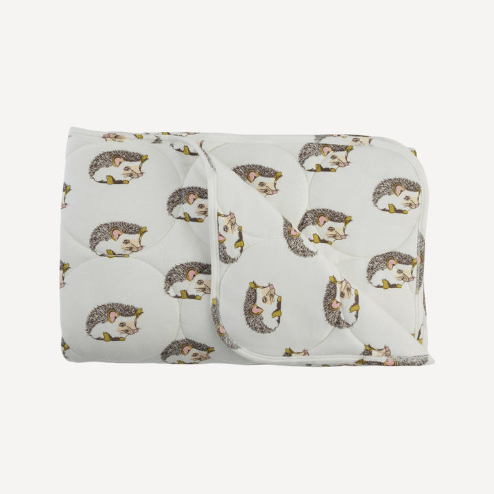 classic circle quilt | gold hedgehogs | bamboo