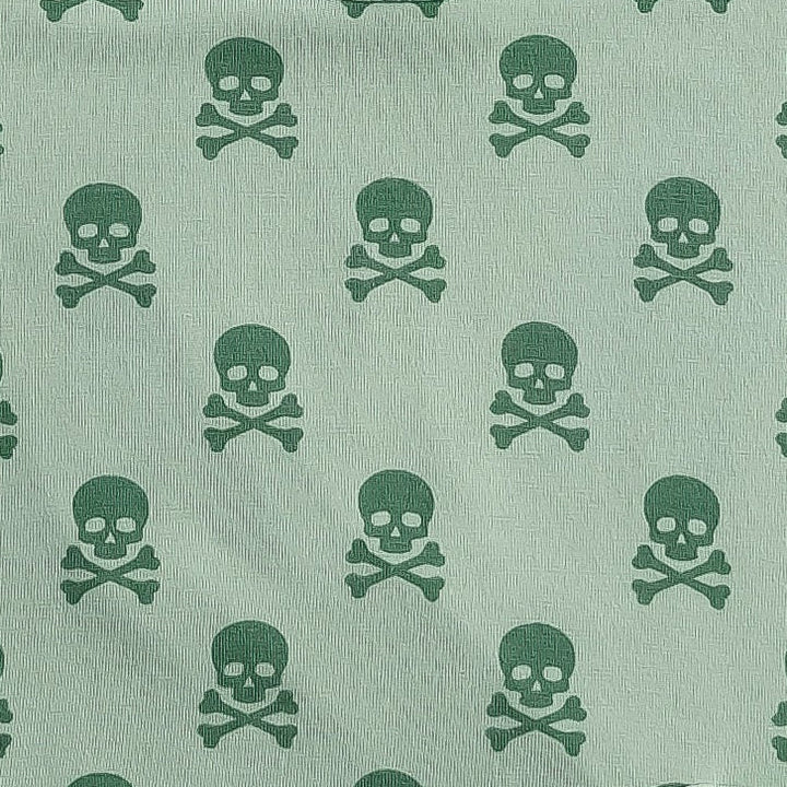 flutter sleeve pom pom pinafore dress | green skulls | organic cotton interlock