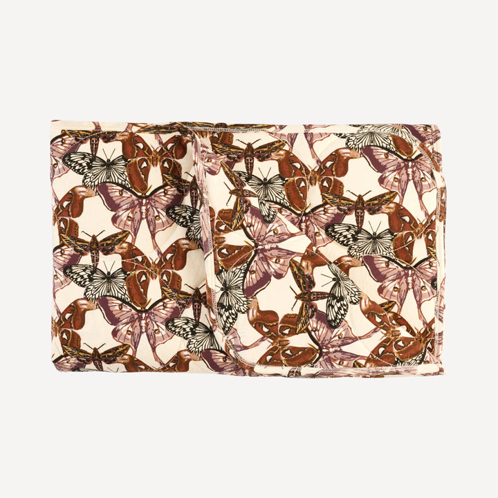 classic circle quilt | moth wallpaper | organic cotton interlock