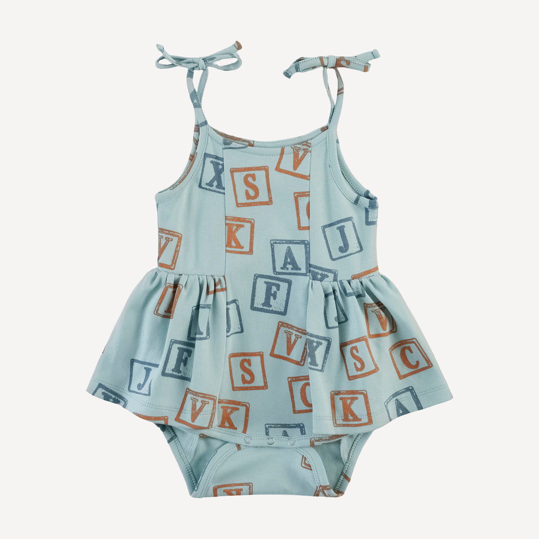 spaghetti tie ballerina bubble | blue alphabet | organic cotton interlock