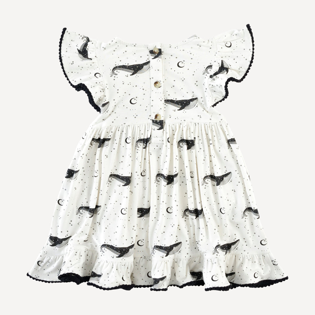 flutter sleeve pom pom pinafore dress | mystical whales | bamboo