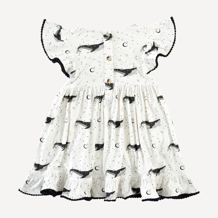 flutter sleeve pom pom pinafore dress | mystical whales | bamboo