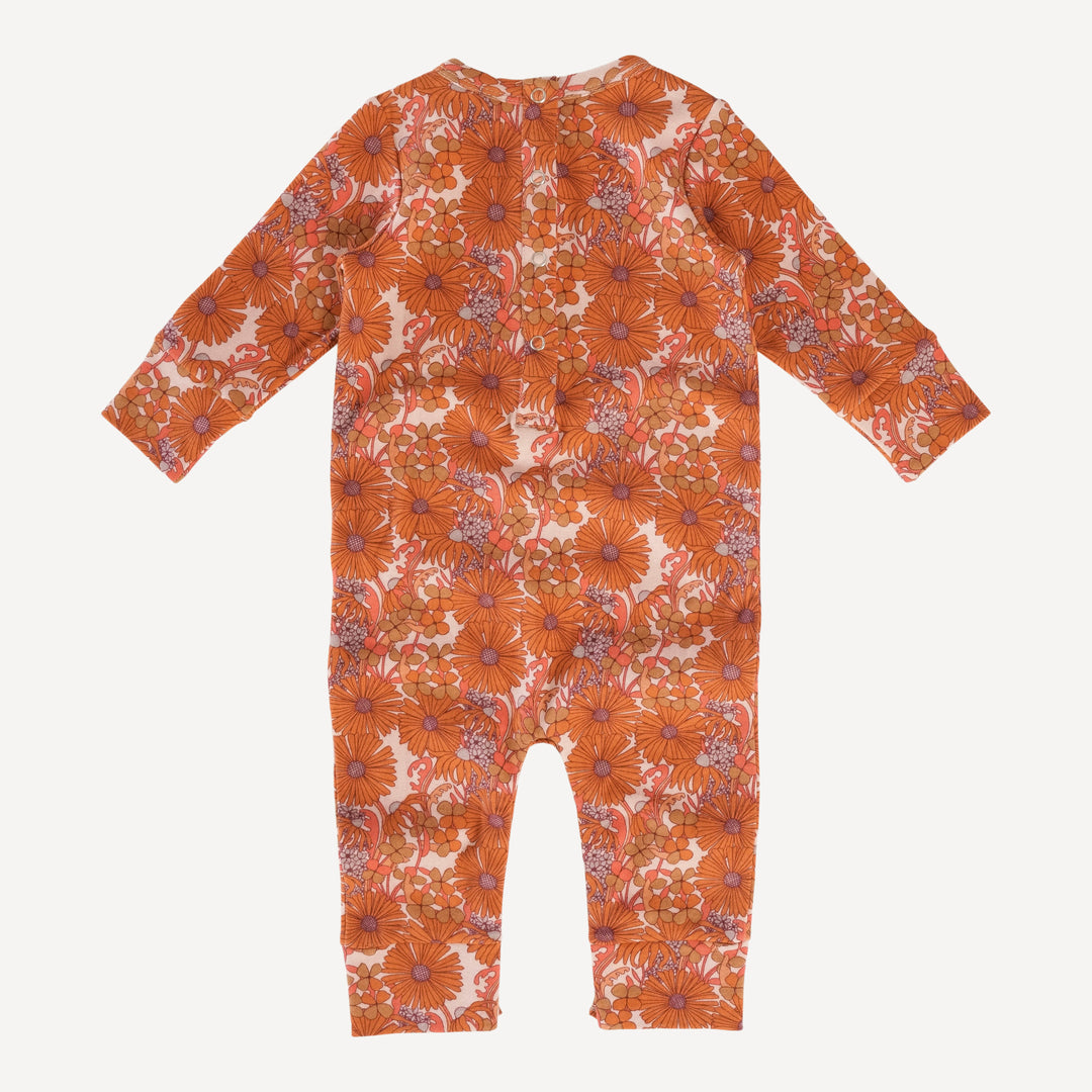 long sleeve topstitch jumpsuit | 70s orange bold daisy | organic cotton interlock