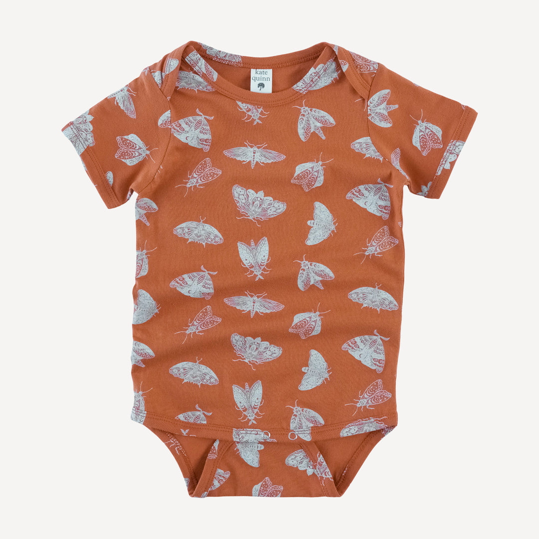 short sleeve lap neck bodysuit | spicy moth scatter | organic cotton jersey