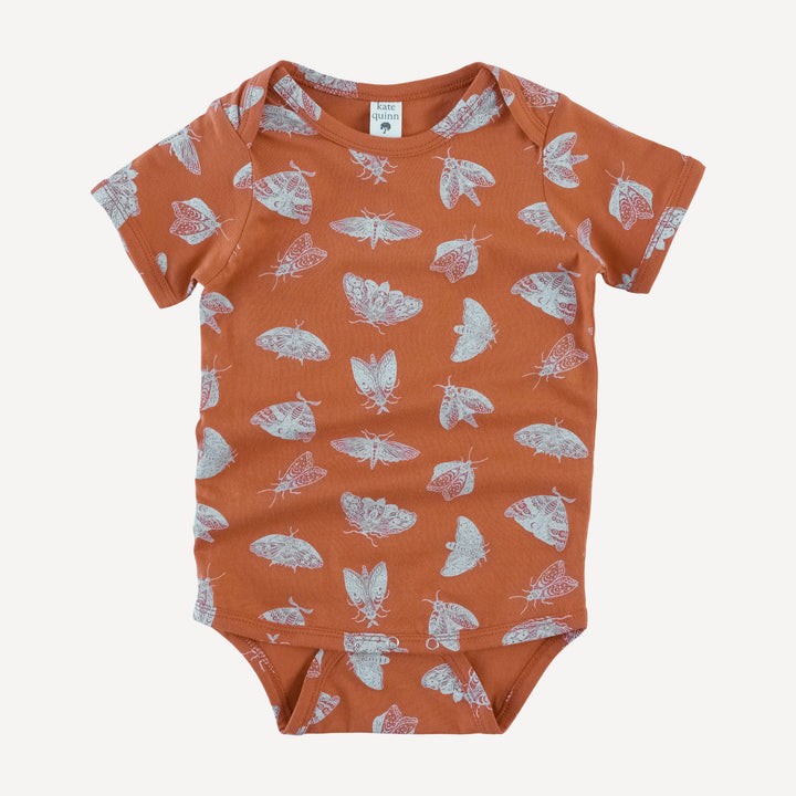 short sleeve lap neck bodysuit | spicy moth scatter | organic cotton jersey