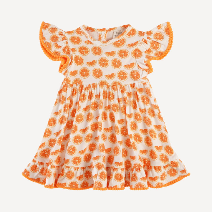 PREORDER flutter sleeve pom pom pinafore dress | orange slices | bamboo