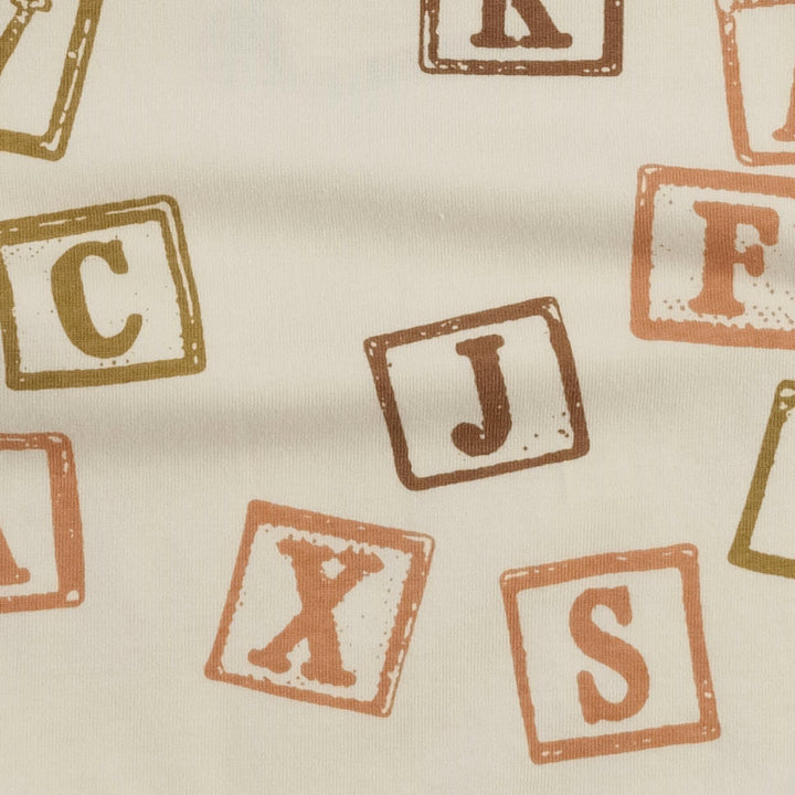 short sleeve lap neck bodysuit | neutral alphabet blocks | organic cotton jersey