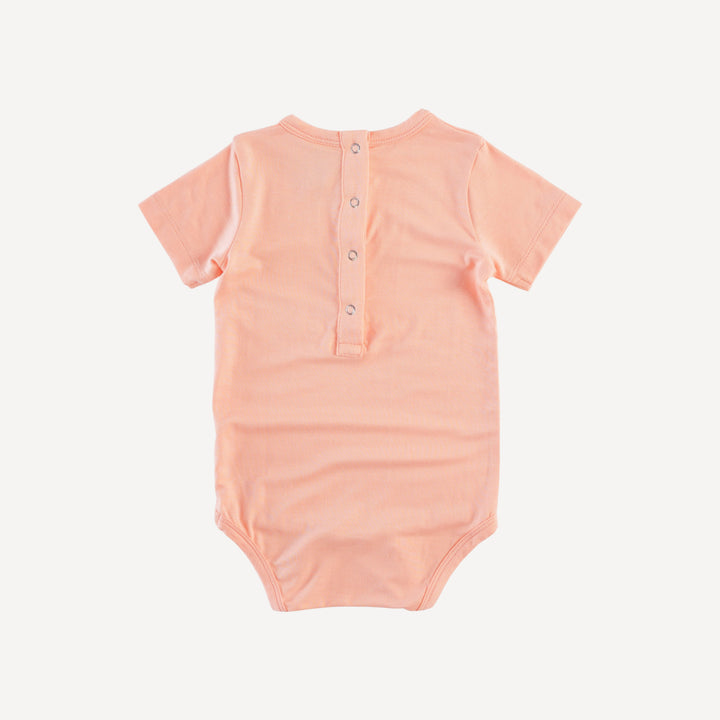 short sleeve piglet crew neck bodysuit | pale apricot | bamboo