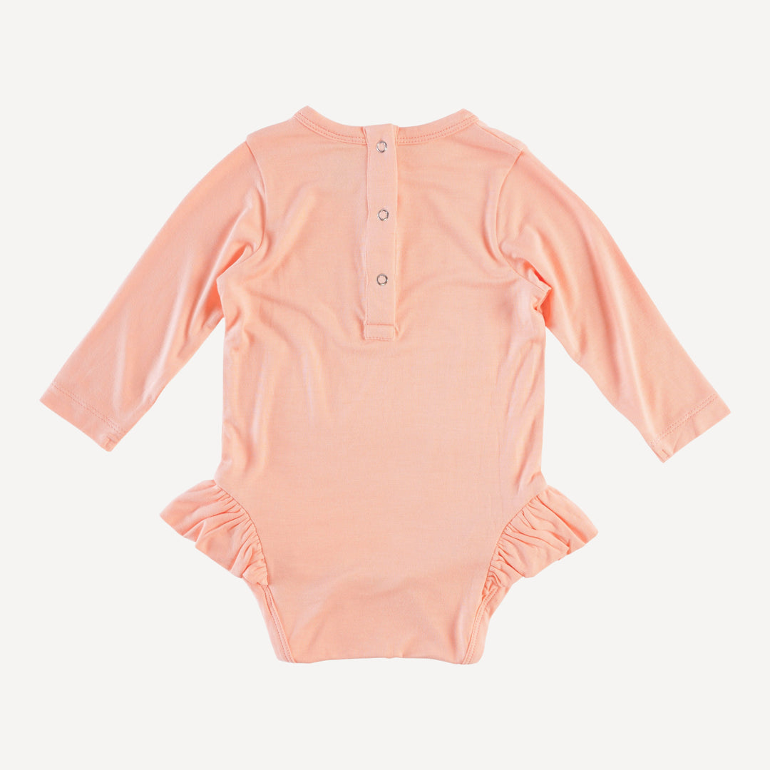 long sleeve ruffle leg bodysuit | pale apricot | bamboo