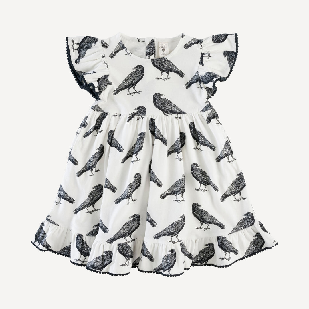 flutter sleeve pom pom pinafore dress | raven | organic cotton jersey