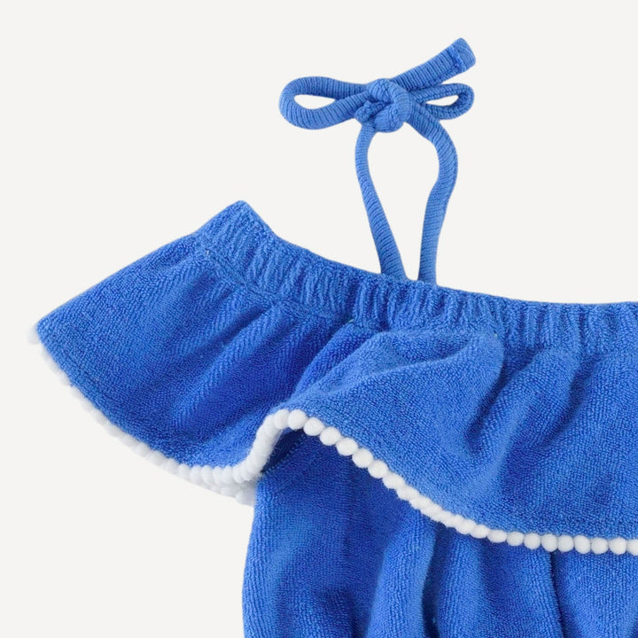 spaghetti tie ruffle off shoulder bubble with pom poms | vivid blue | organic cotton terry